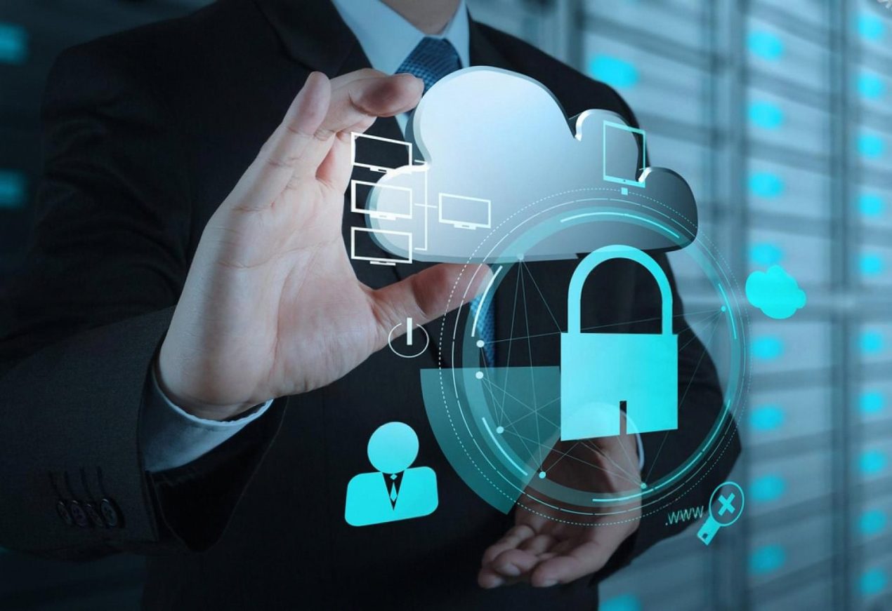 Business professional holding a cloud and padlock graphic, symbolising managed IT security in Dubai