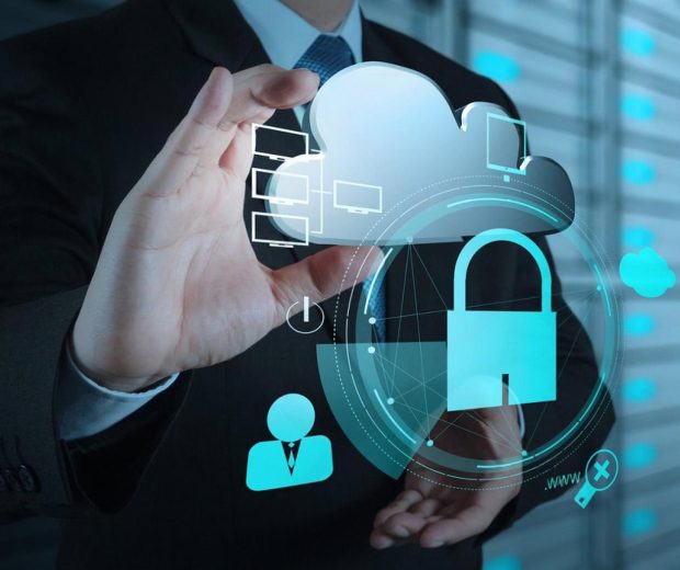 Business professional holding a cloud and padlock graphic, symbolising managed IT security in Dubai