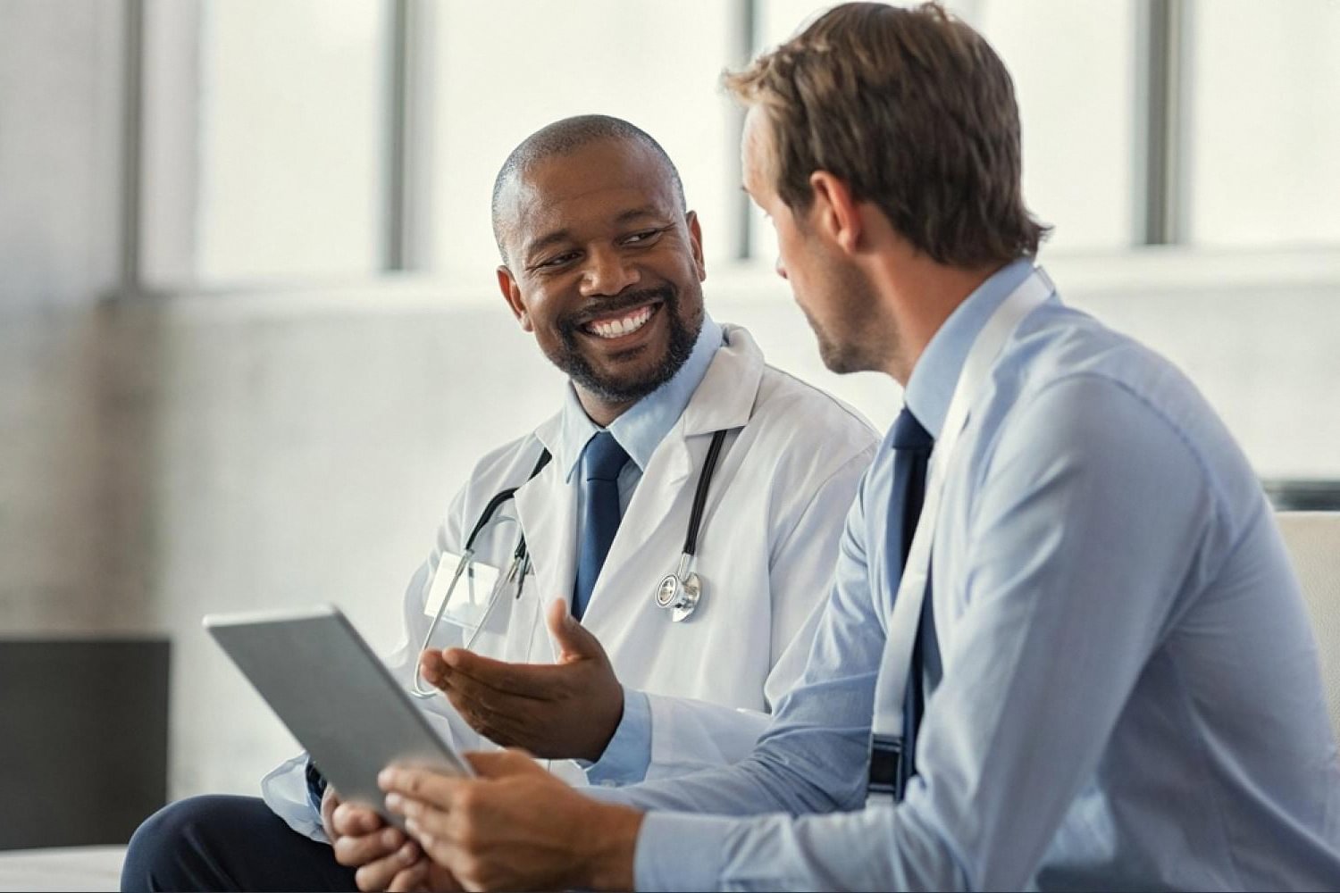Doctor discussing recovery progress with a patient after weight loss surgery